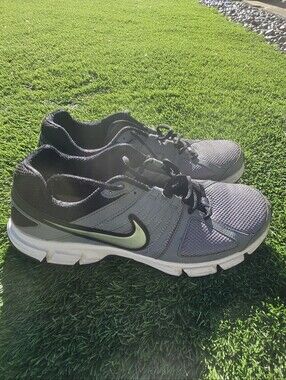 grey Nike Downshifter 5 MSL running shoes featuring a distinctive green Logo